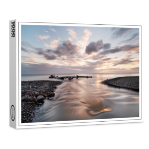 raxxa Premium-Puzzle: Fluss und Treibholz im Sonnenuntergang